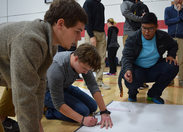 Students designing a boat for the 2016 Mechanical Engineering Learning Team boat race competition