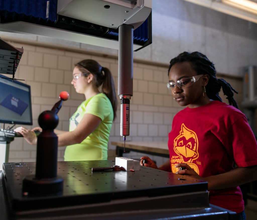 A student uses the coordinate measuring machine in the metrology lab.