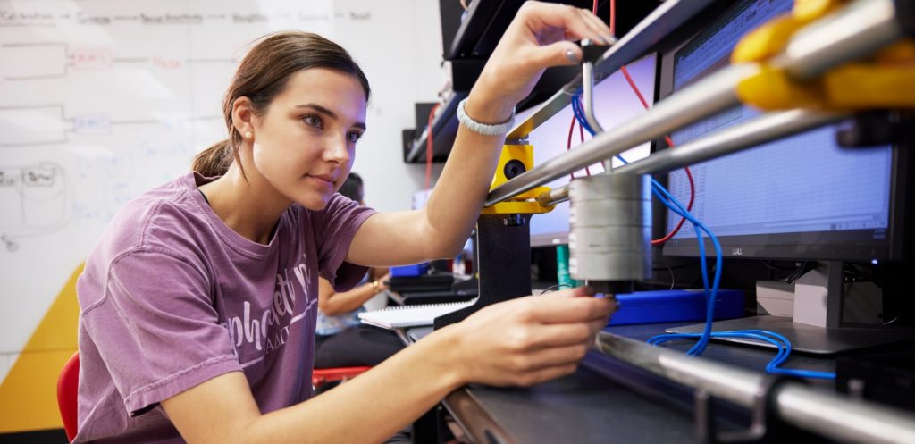 A student works inside a lab