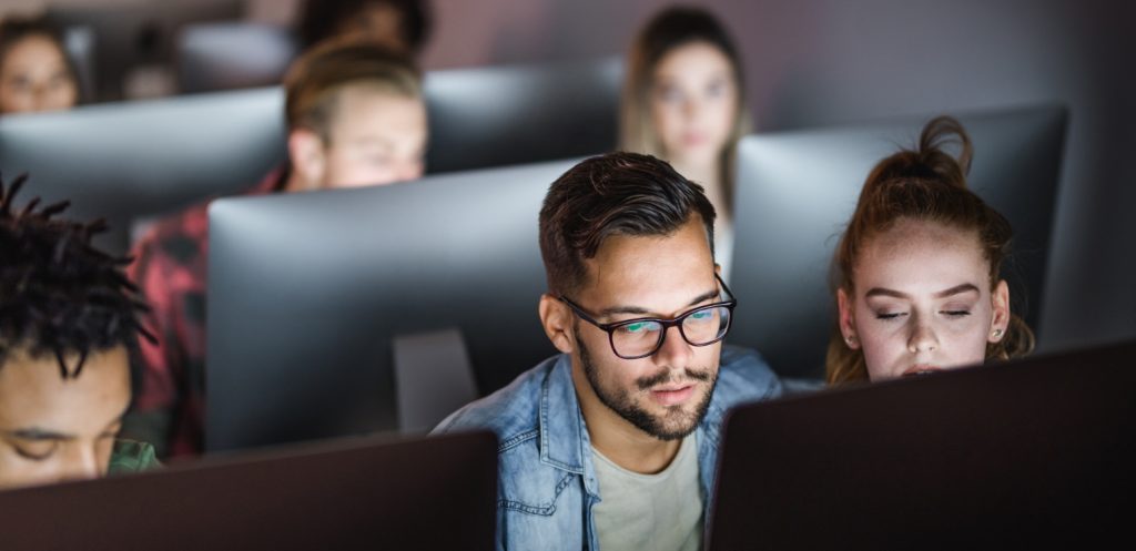 A group of students working at computers