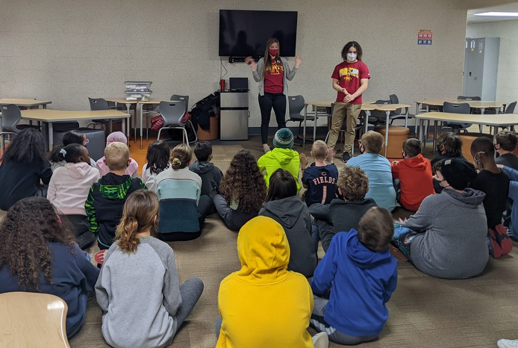 College engineering students present to a group of K12 students