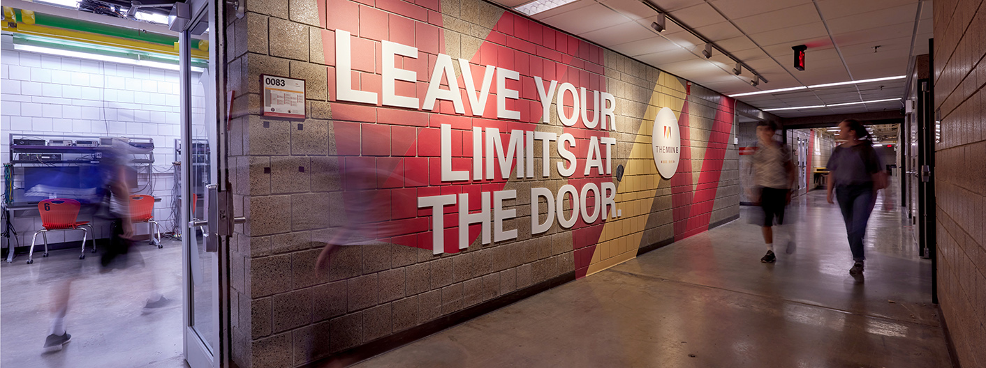 A hallway in a Mechanical Engineering building that reads, "leave your limits at the door."